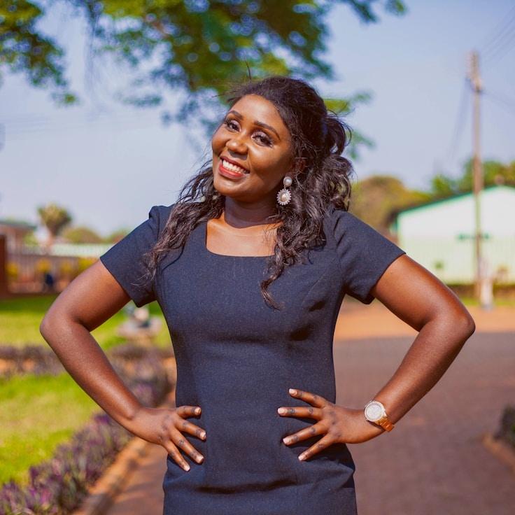 Alex Doe, Lead Design Curator at Green Forest Collective, reviewing corporate floral arrangements